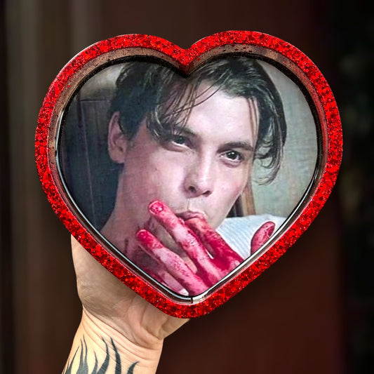 Scream-inspired Billy Loomis Ghostface corn syrup heart-shaped resin trinket dish being held