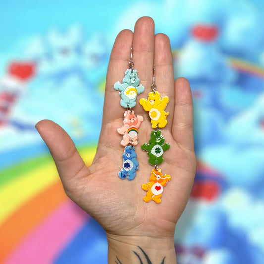 Care Bears stacked resin statement earrings being held