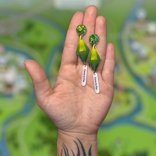 The Sims 4 plumbob interaction bubble glitter resin statement earrings being held
