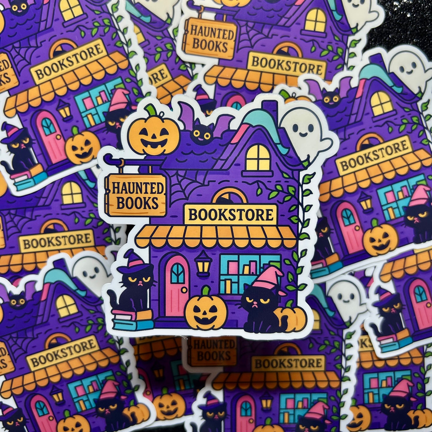 Halloween-themed stickers with haunted bookstore design on a black background