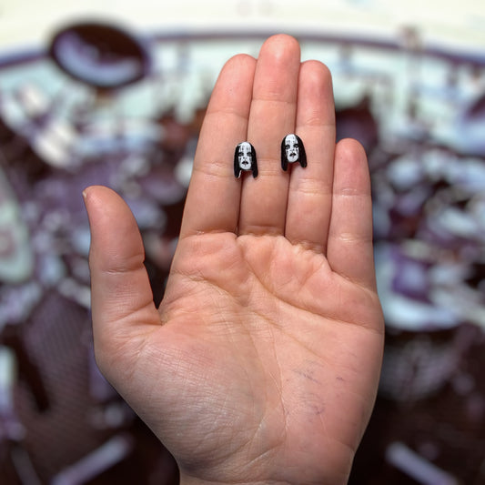 Slipknot Vol. 3-era Joey Jordison mask resin stud earrings being held