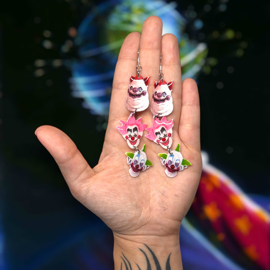 Killer Klowns from Outer Space-inspired stacked Klown resin statement earrings being held