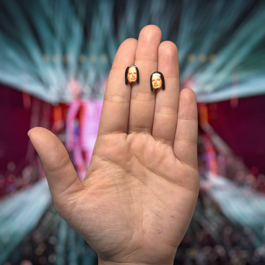 Korn Jonathan Davis face resin stud earrings being held