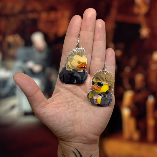 The Lost Boys David and Michael vampire ducks Chinese food resin statement earrings being held