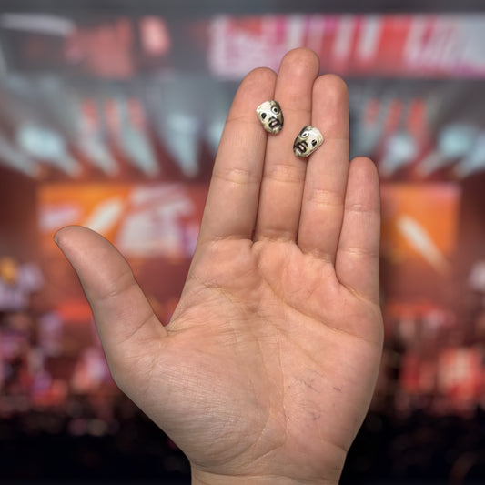 Slipknot All Hope Is Gone AHIG-era Corey Taylor mask resin stud earrings being held