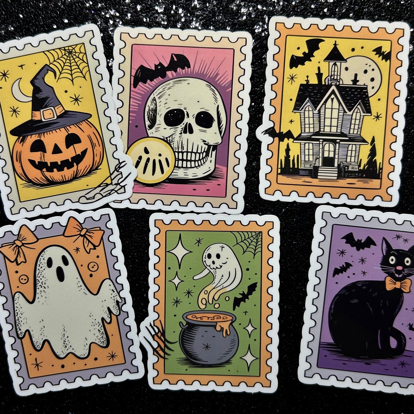 Set of Halloween-themed postage stamp stickers with various spooky illustrations on a black background.