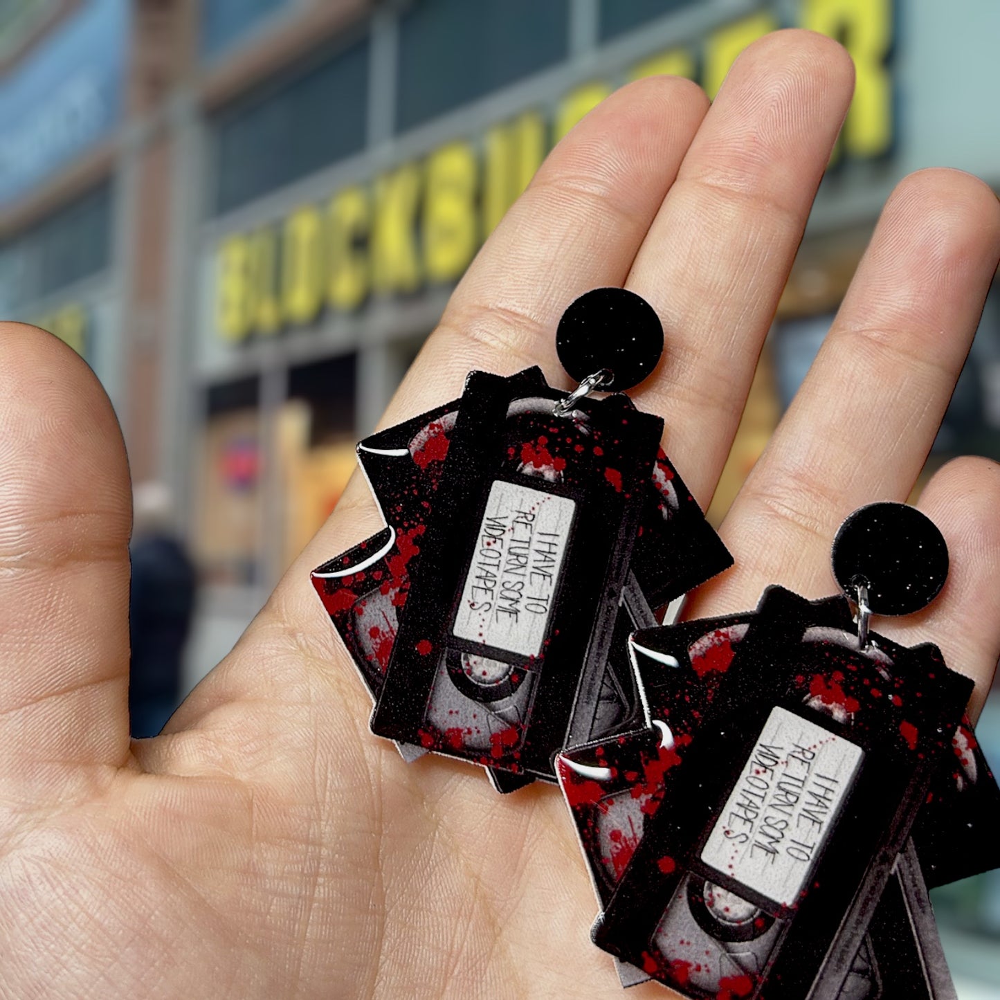 American Psycho-inspired I Have to Return Some Videotapes Patrick Bateman quote resin statement earrings detail
