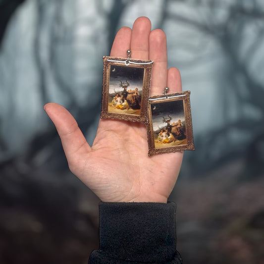 Witches' Sabbath Francisco Goya framed art resin statement earrings being held