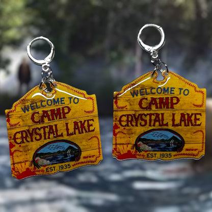 Friday the 13th bloody Jason Voorhees Camp Crystal Lake sign resin statement earrings on a blurry lake background