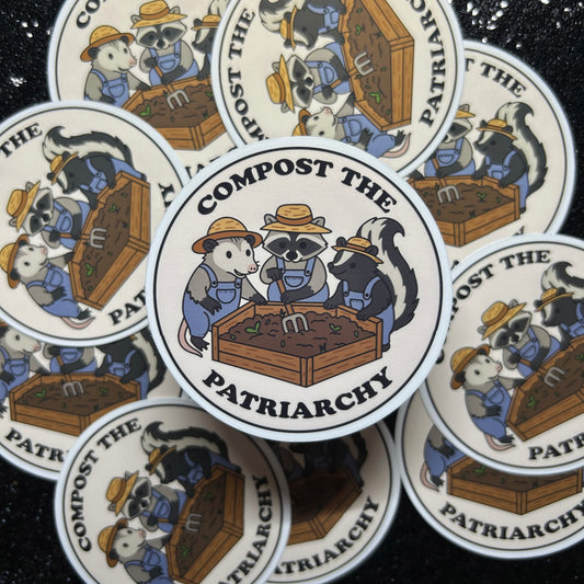 Stickers with a raccoon, a skunk, and a possum wearing overalls and composting and text 'Compost the Patriarchy' on a black background