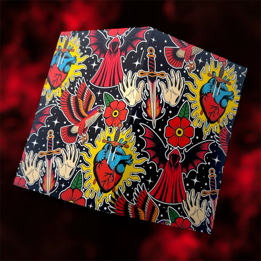 The front and back covers of a pocket notebook of a dark romance fantasy collage design on a blurred red and black background 