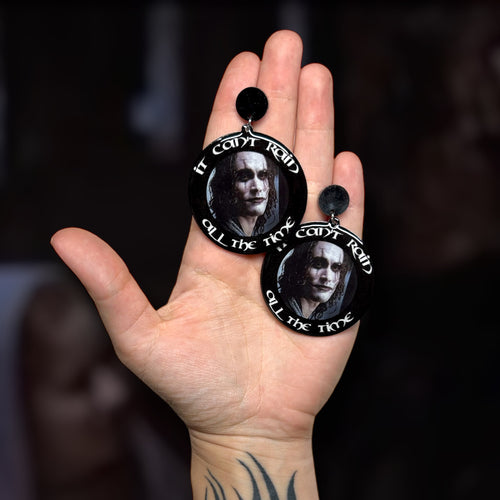 The Crow 1994 Brandon Lee Eric Draven quote It Can't Rain All the Time resin statement earrings being held