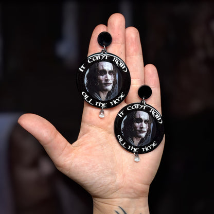 The Crow 1994 Brandon Lee Eric Draven quote It Can't Rain All the Time glass rain drop resin statement earrings being held