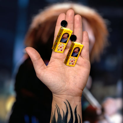 Child's Play-inspired Good Guys Chucky box resin statement earrings being held