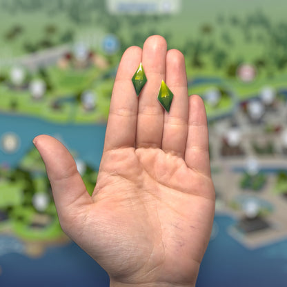 The Sims-inspired The Sims 4 TS4 green plumbob resin stud earrings being held