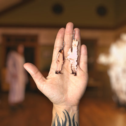 Hereditary-inspired fiery Steve resin statement earrings being held