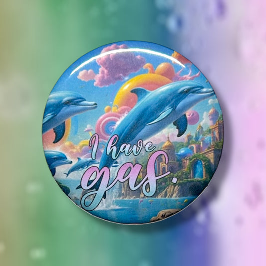 Button with rainbow Lisa Frank dolphins and 'I have gas' text on a colorful background
