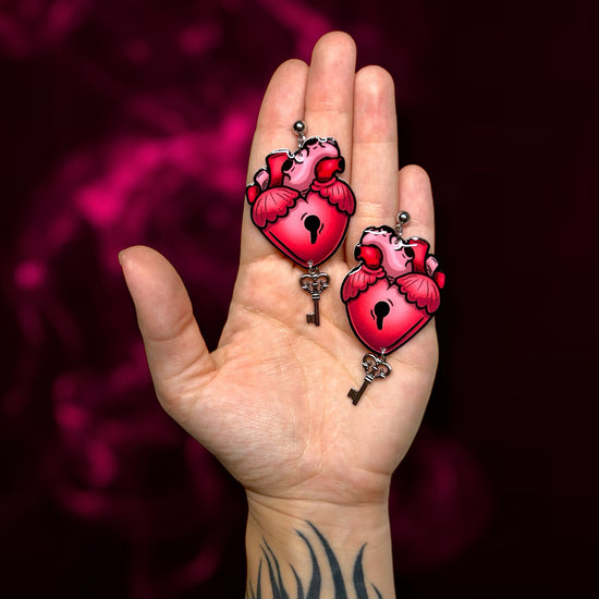 Key to my heart locked key skeleton key goth Valentine's Day Valloween resin statement earrings being held