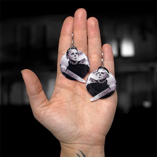 Hand holding Halloween Michael Myers with knife resin horror dangle earrings