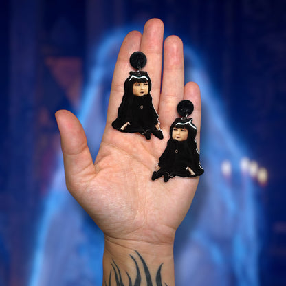 What We Do in the Shadows Nadja doll Nadja of Antipaxos resin statement earrings being held