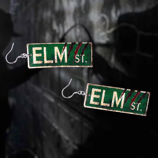 A Nightmare on Elm Street-inspired bloody Elm St sign resin statement earrings