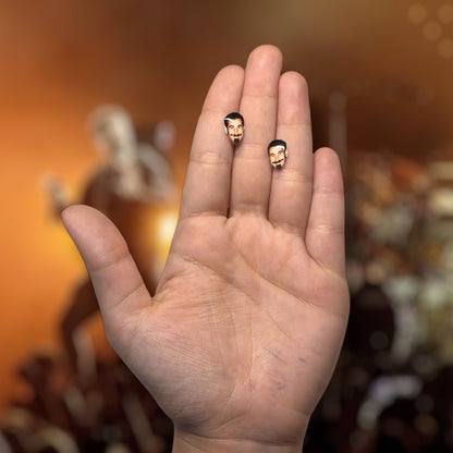 System of a Down Serj Tankian face resin stud earrings being held