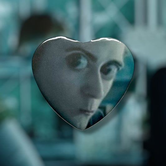 Twilight Edward Cullen meme biology class sparkly vampire button on a blurry blue background.