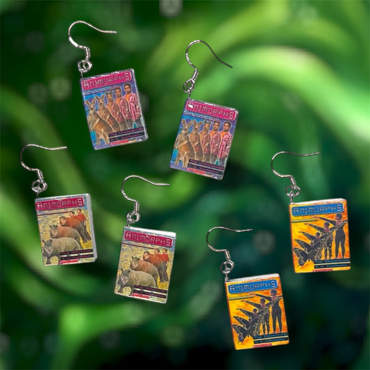 Various Animorphs books on a blurry green background