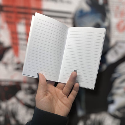 Lined pages in a pocket notebook on a blurry background