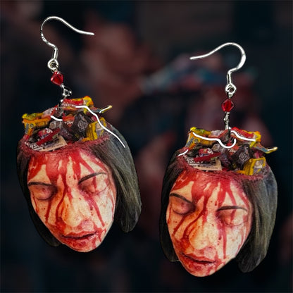 Terrifier 2 Allie's mom bloody candy bowl head beaded resin statement earrings on a blurred background