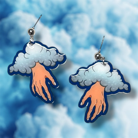 Blue cloud hand oddities and curiosities statement earrings on a blue background