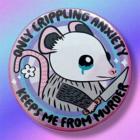Pinback button with a crying possum holding a knife that says "Only Crippling Anxiety Keeps Me from Murder" on a blurry pink, purple, and blue background