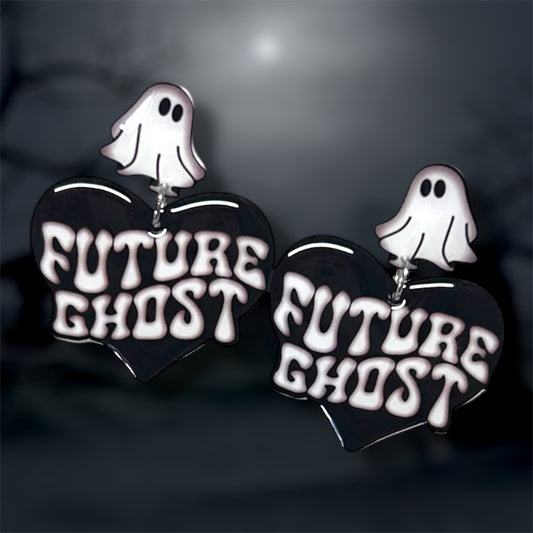 Future Ghost heart-shaped statement earrings with sheet ghost studs on a blurry background
