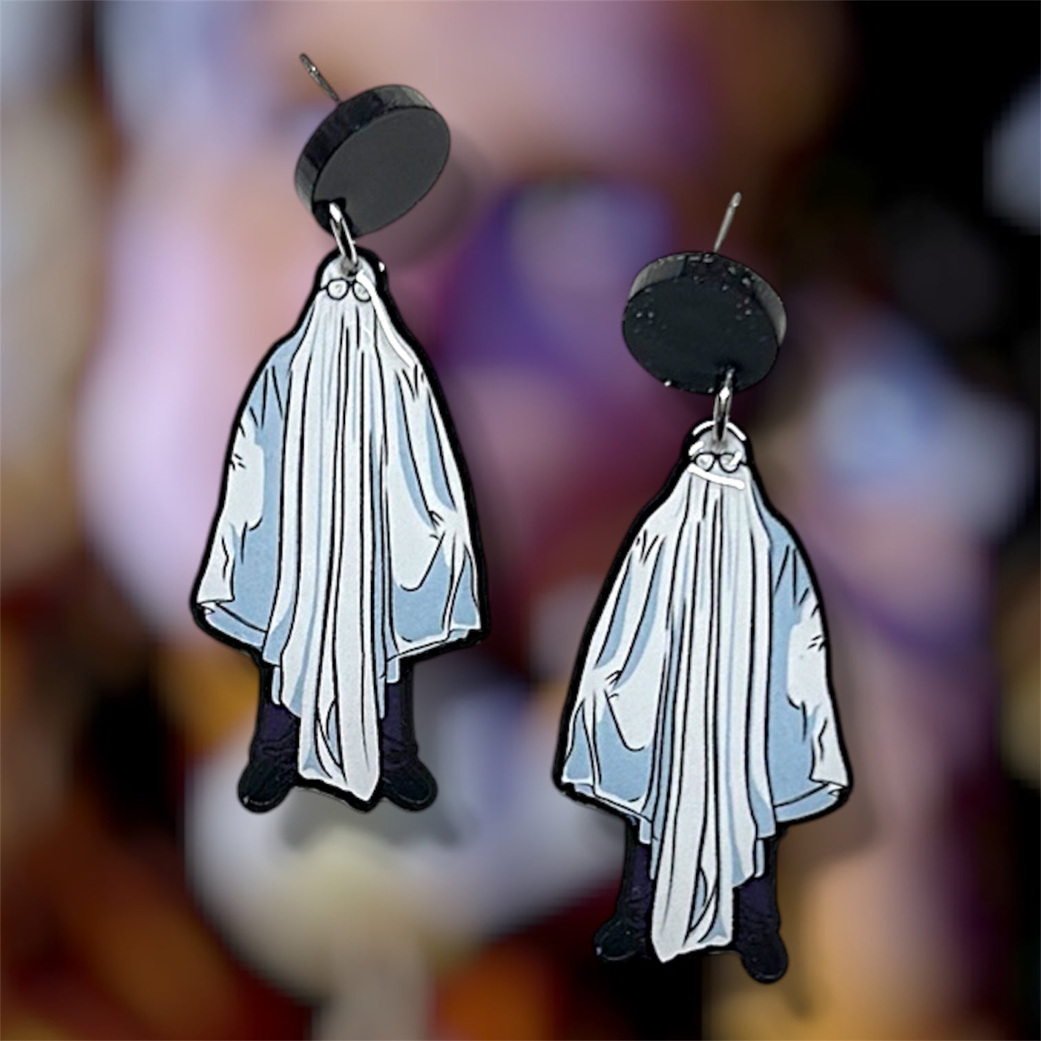 Halloween Michael Myers sheet ghost resin dangle earrings on a blurry background