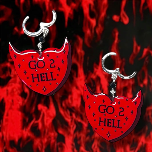 Red and black sparkly devil horns heart "Go 2 Hell" beaded resin dangle earrings on a blurry fiery background