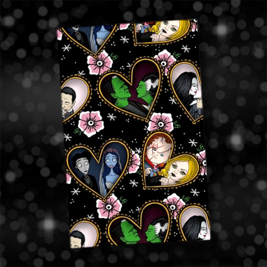 Horror lovers ruffle-heart and traditional-style pink flower collage notebook, featuring Victor and Emily from the Corpse Bride, the Bride of Frankenstein and Frankenstein's Monster, Chucky and Tiffany from Child's Play, and Morticia and Gomez from The Addams Family