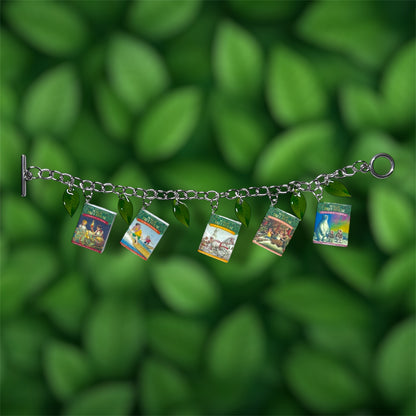 Magic Treehouse miniature book and green leaf charm bracelet on a green leafy background