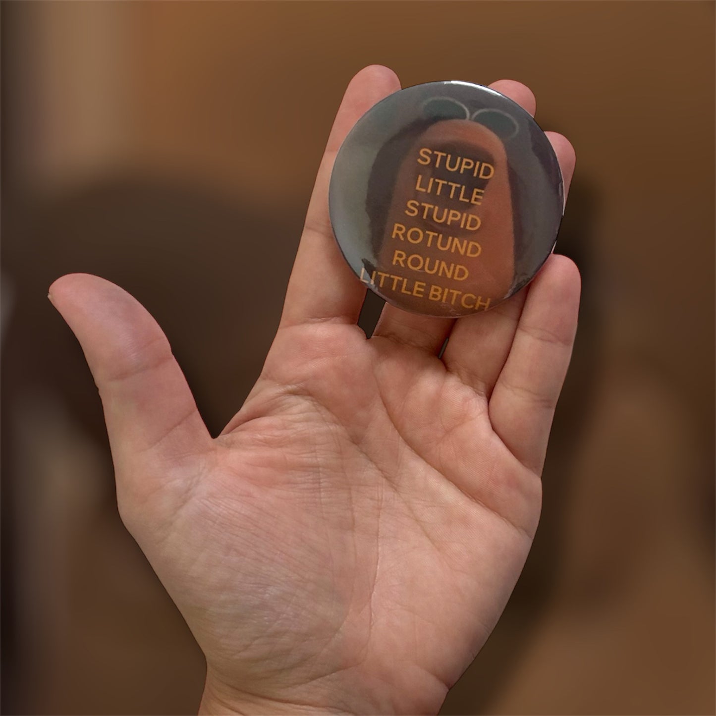 Large Marcus the worm "Stupid little stupid rotund round little bitch" Frederick meme pinback button