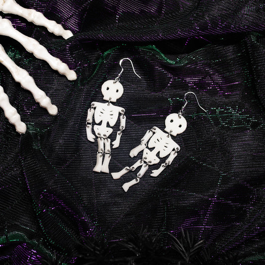 White resin Halloween skeleton dangle earrings